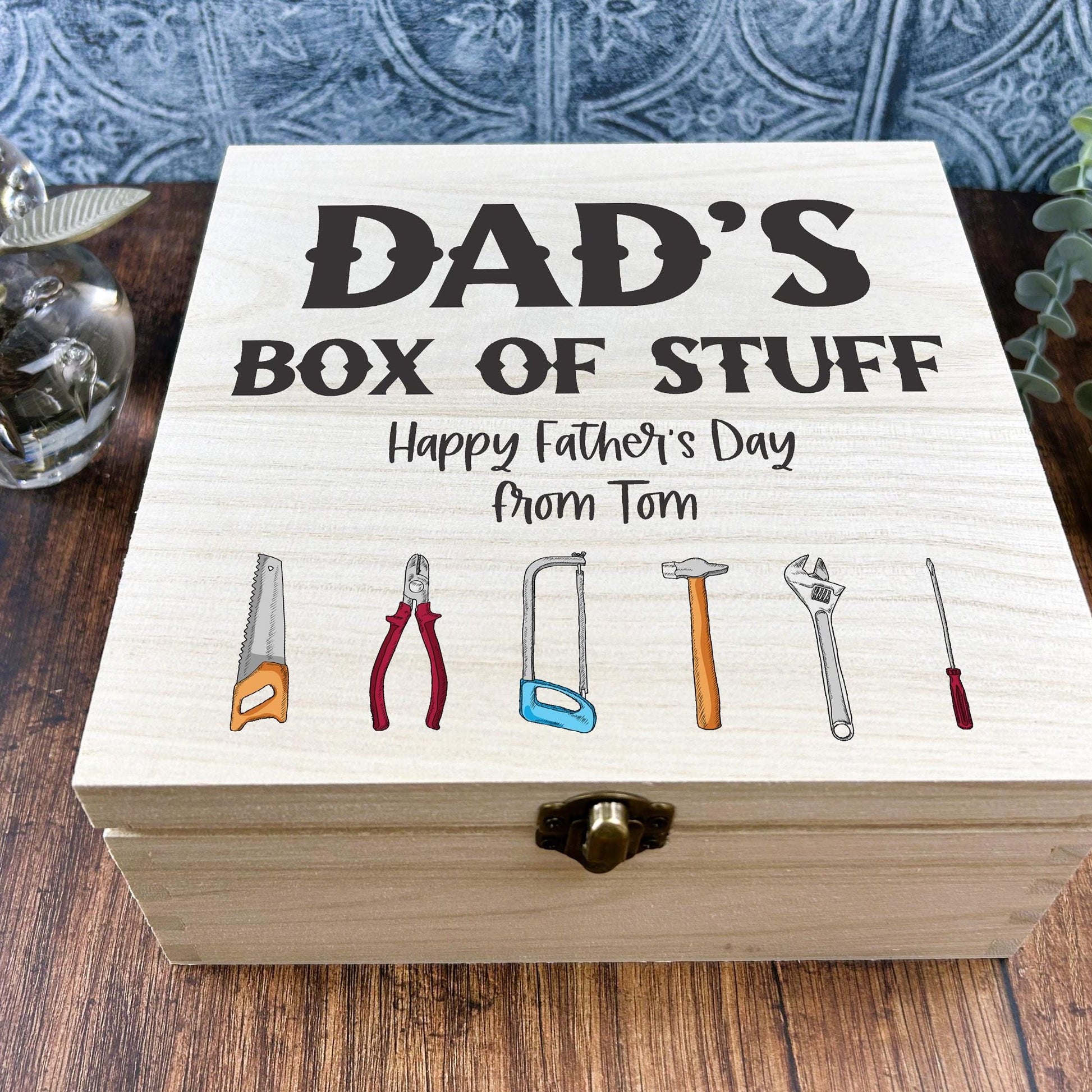 a wooden box with a picture of tools on it