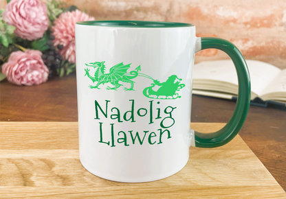 a green and white coffee mug sitting on top of a wooden table