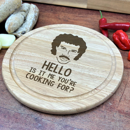 a wooden cutting board with a picture of a man on it