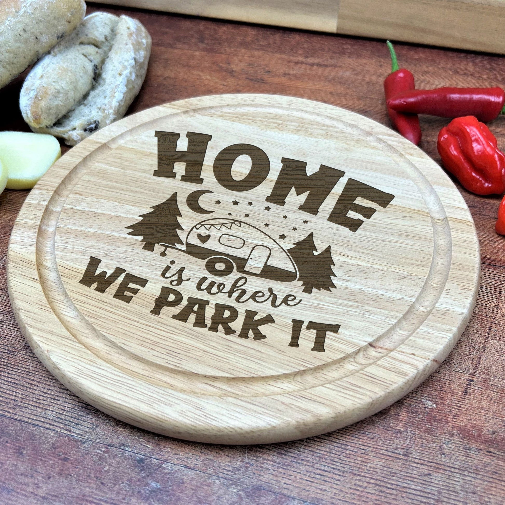 a wooden cutting board with a picture of a camper on it
