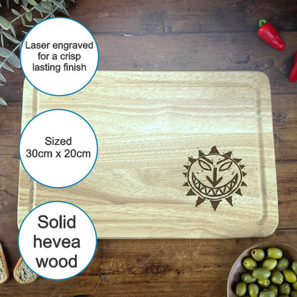 a cutting board with a picture of a smiling face on it