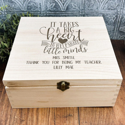a wooden box that says it takes a big heart to teach little minds
