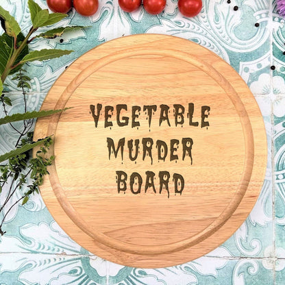 a wooden board with the words vegetable murder board on it