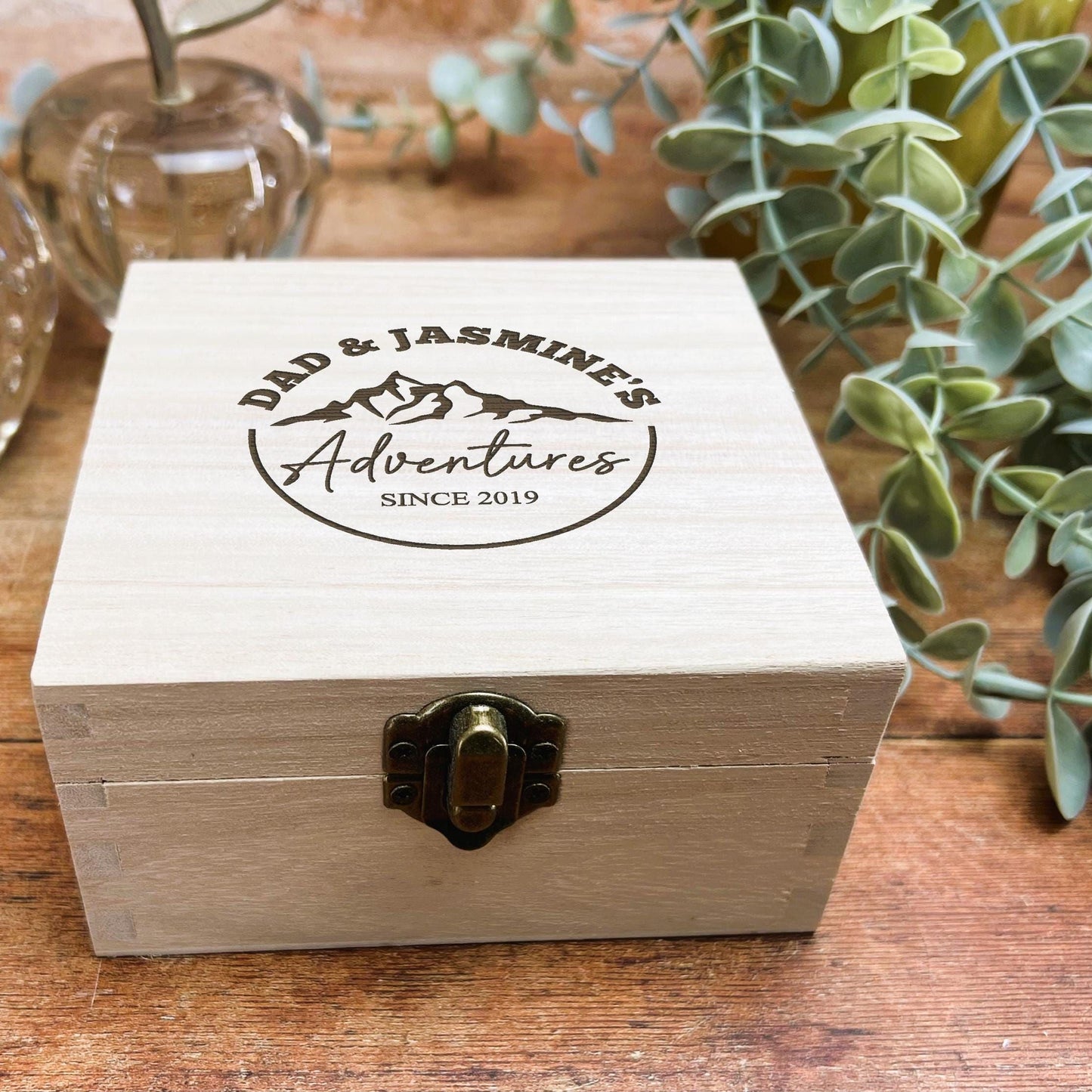 a wooden box sitting on top of a wooden table