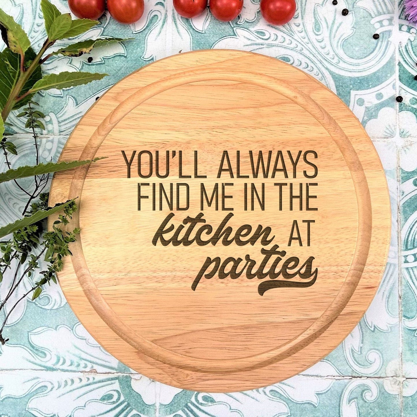 a wooden cutting board with the words you'll always find me in the kitchen