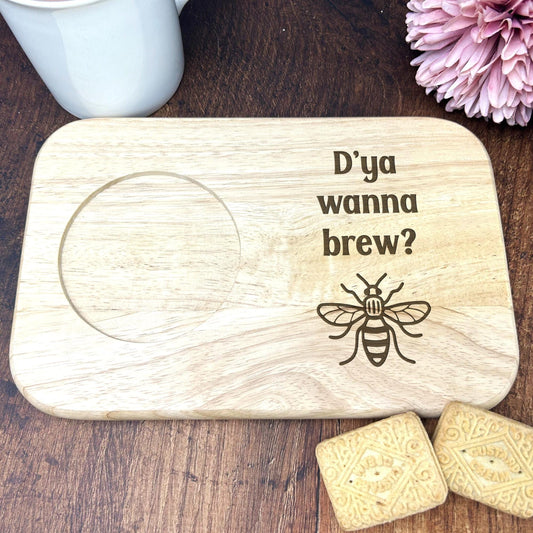 a wooden coaster with a picture of a bee on it