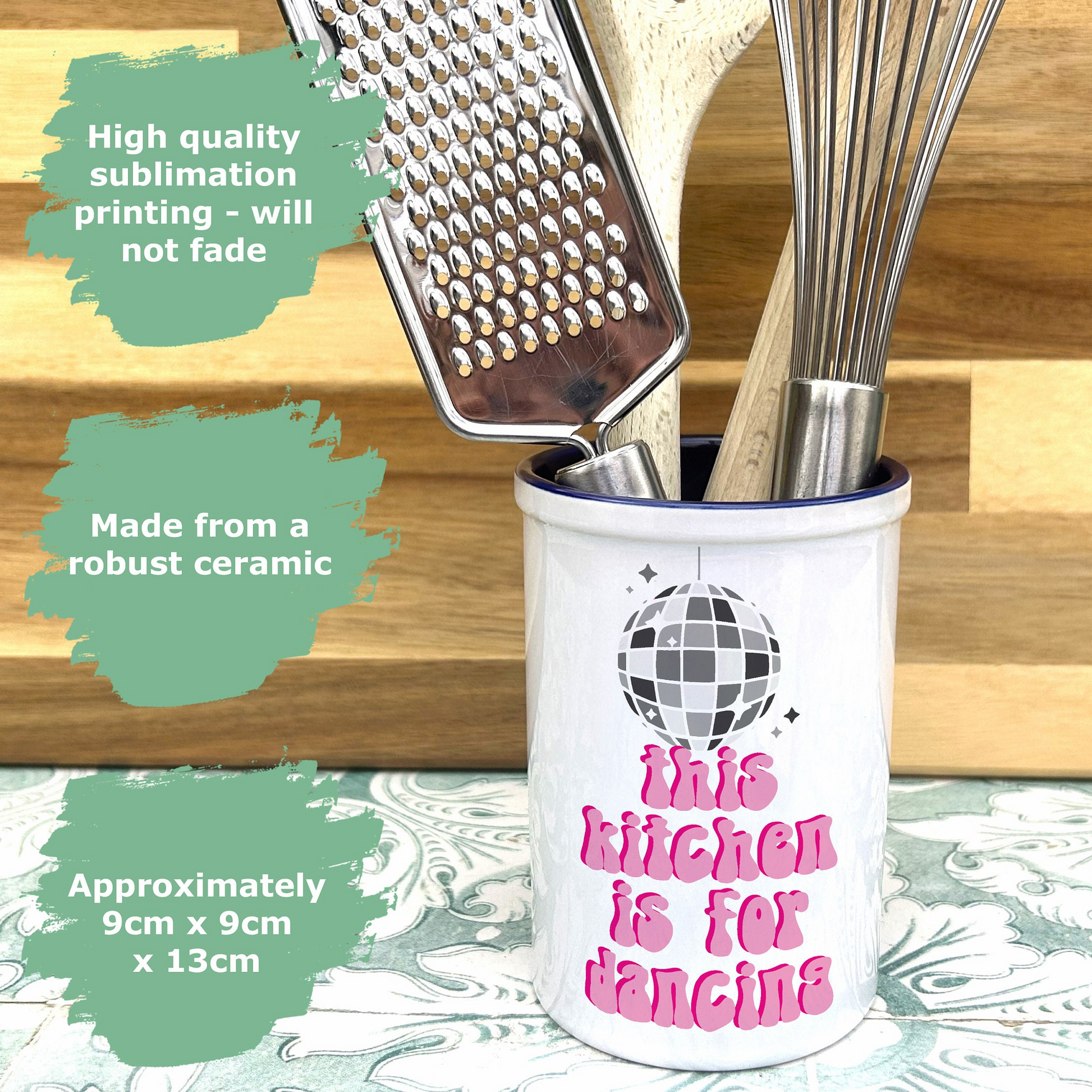 a kitchen utensil holder with the words this kitchen is for dancing on it
