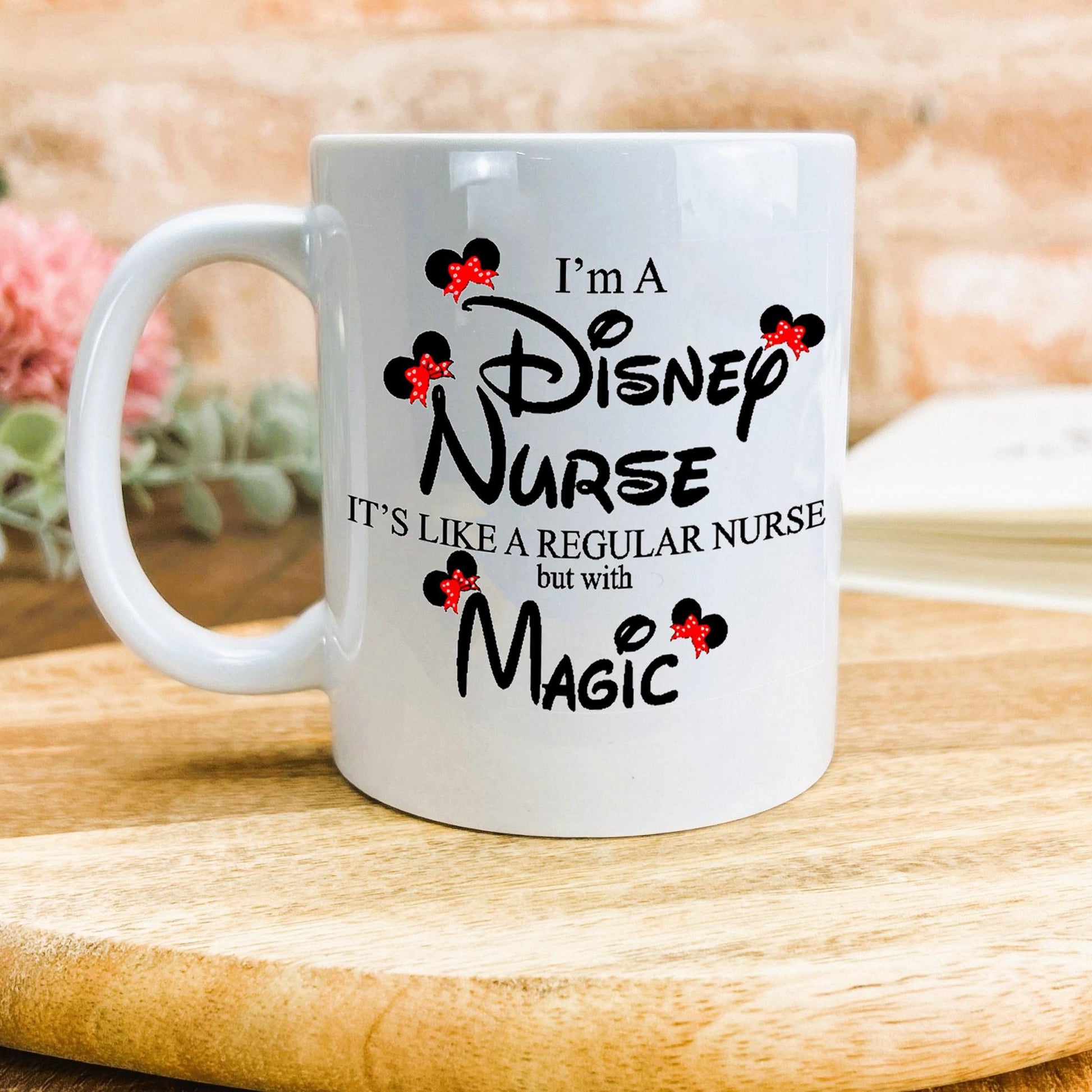 a white coffee mug sitting on top of a wooden table