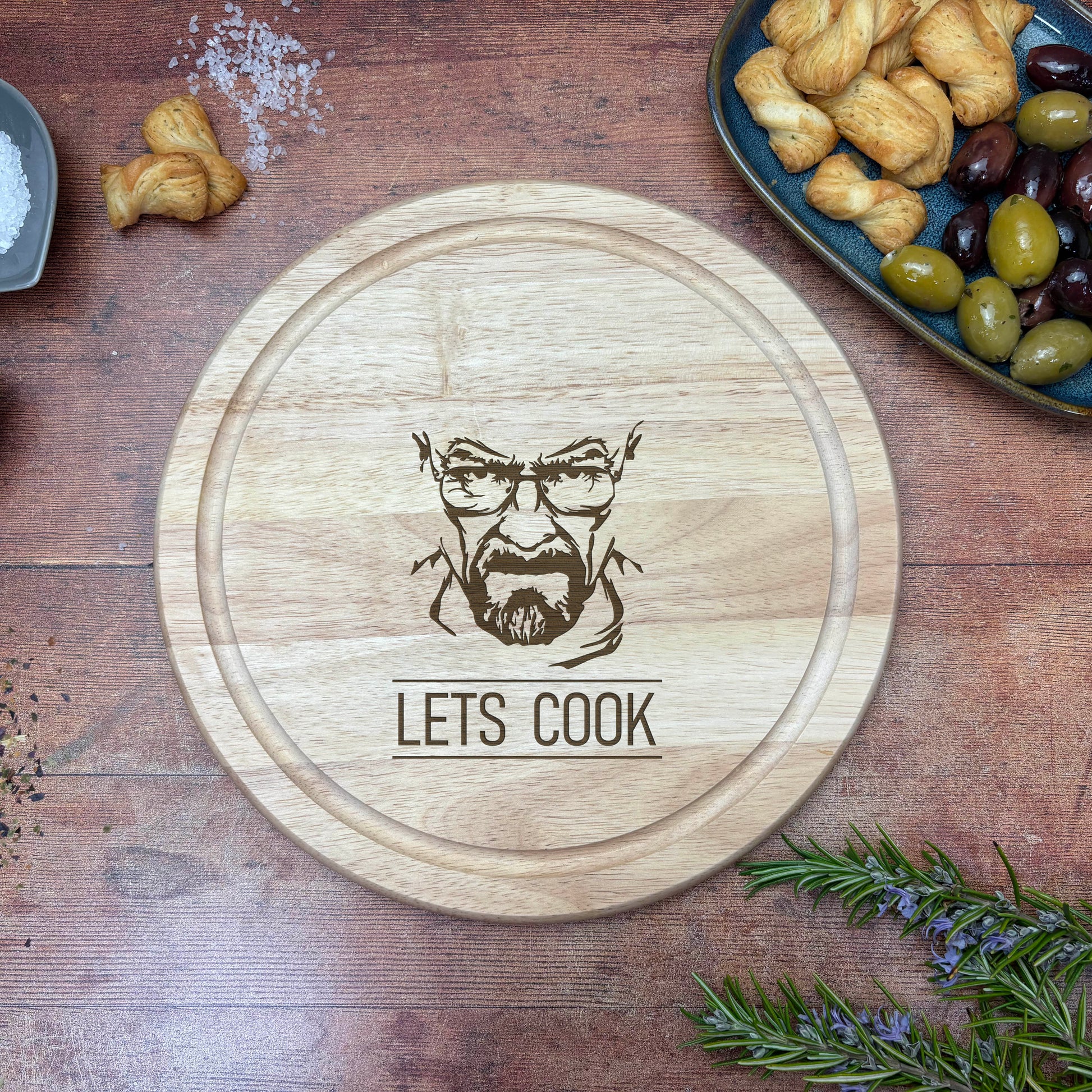 a wooden cutting board with a picture of a man's face on it