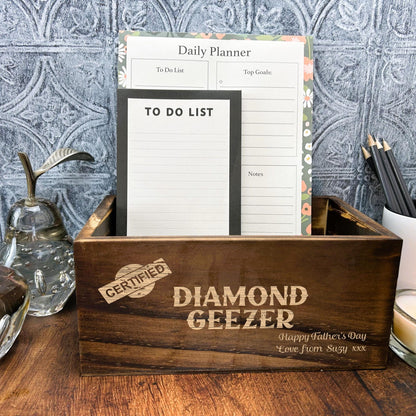 a wooden box sitting on top of a wooden table