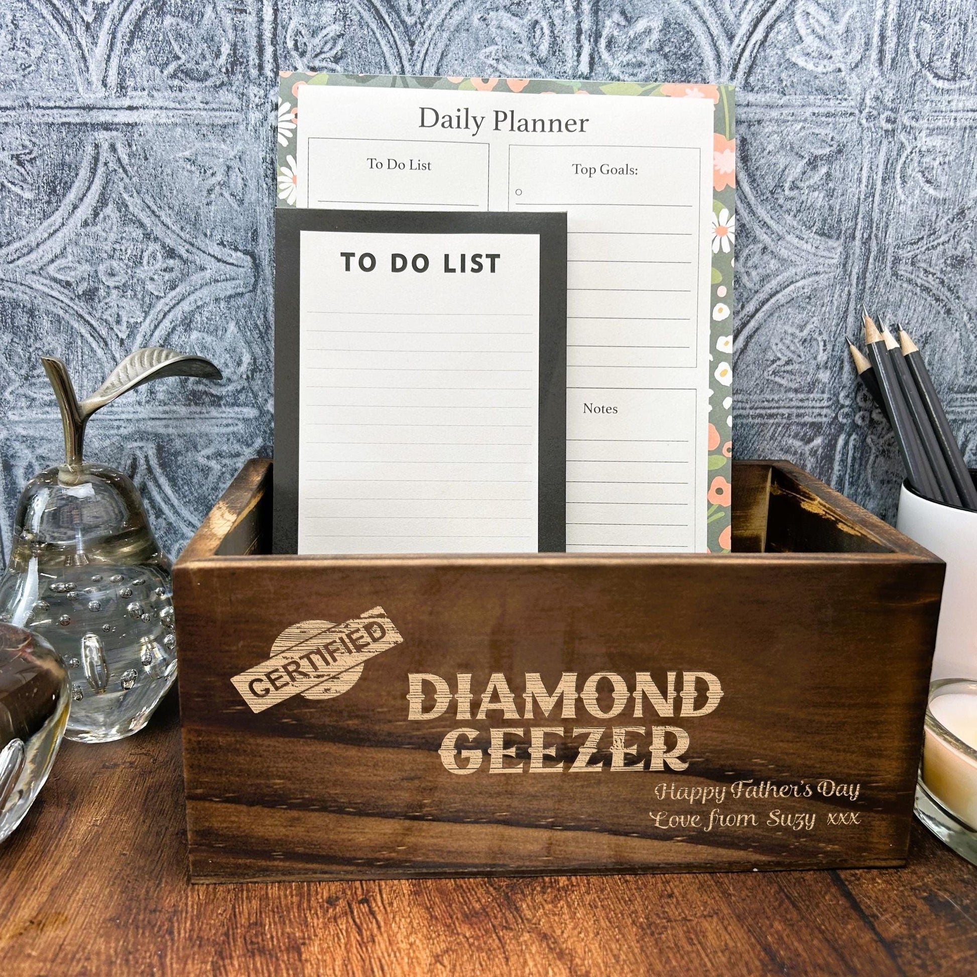 a wooden box sitting on top of a wooden table