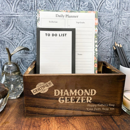 a wooden box sitting on top of a wooden table