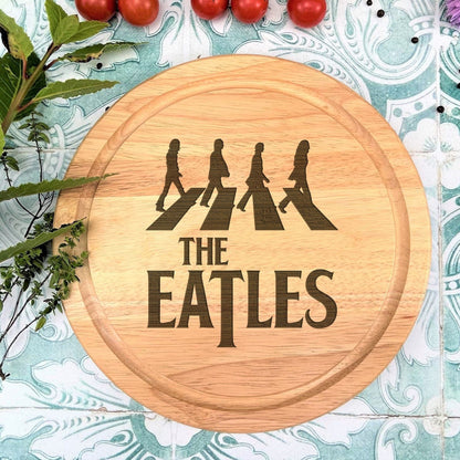 a cutting board with the words the beatles on it