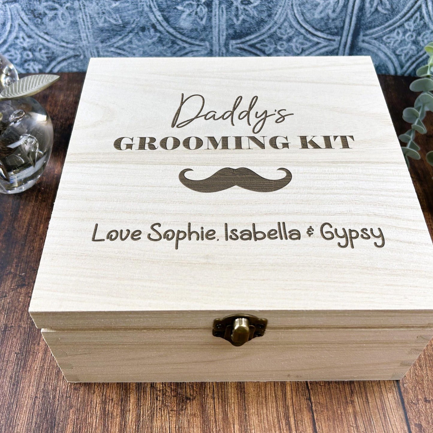 a wooden box sitting on top of a wooden table