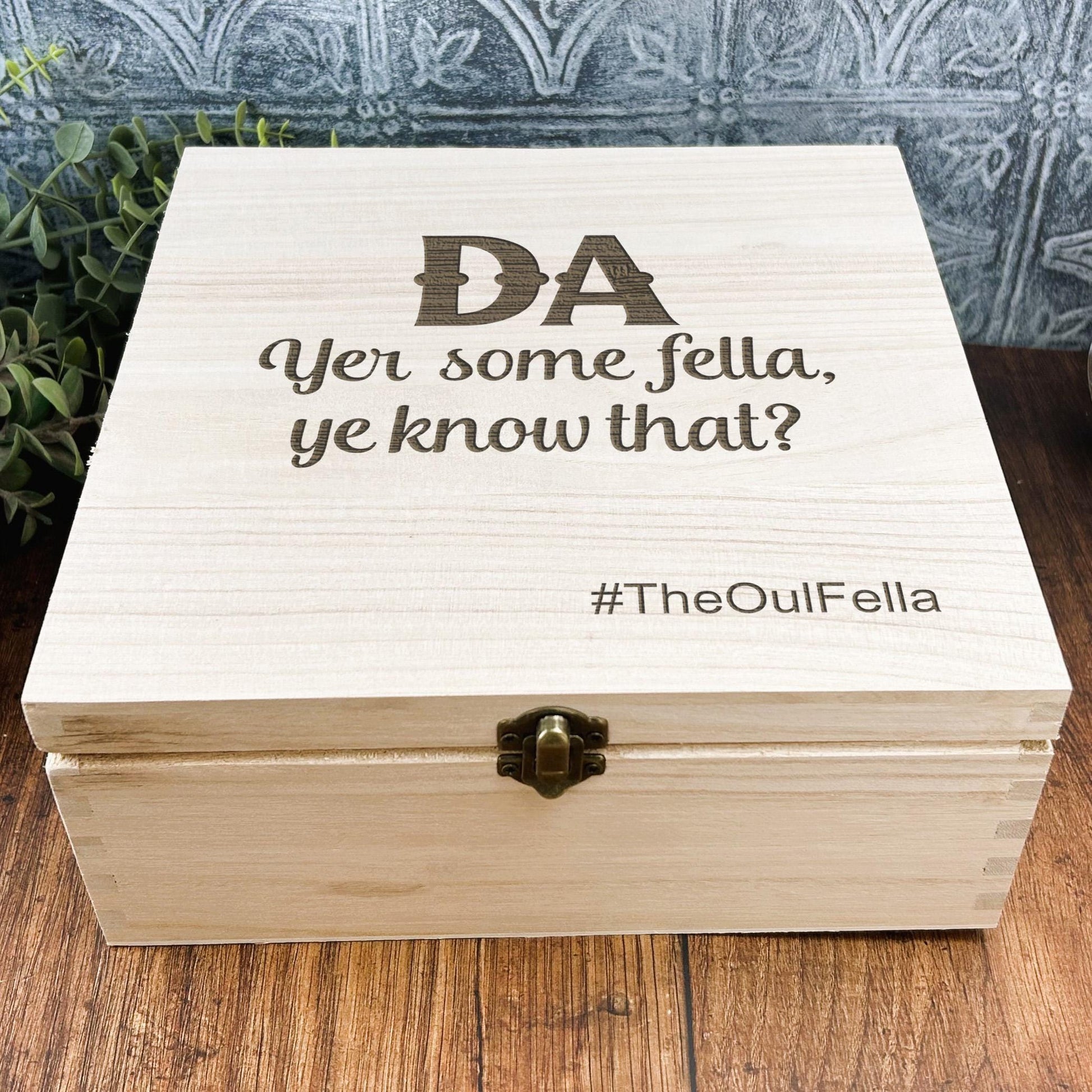 a wooden box sitting on top of a wooden table