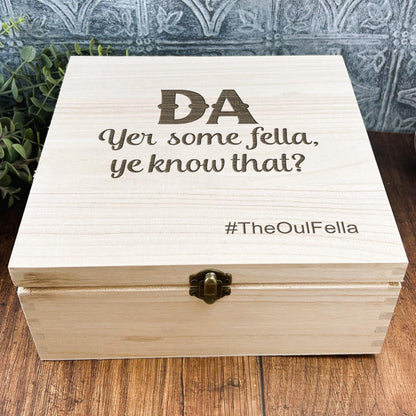 a wooden box sitting on top of a wooden table