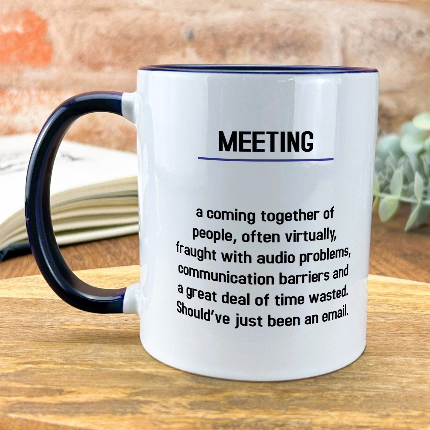 a coffee mug sitting on top of a wooden table