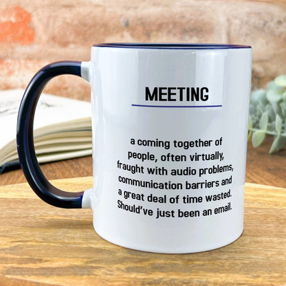 a coffee mug sitting on top of a wooden table