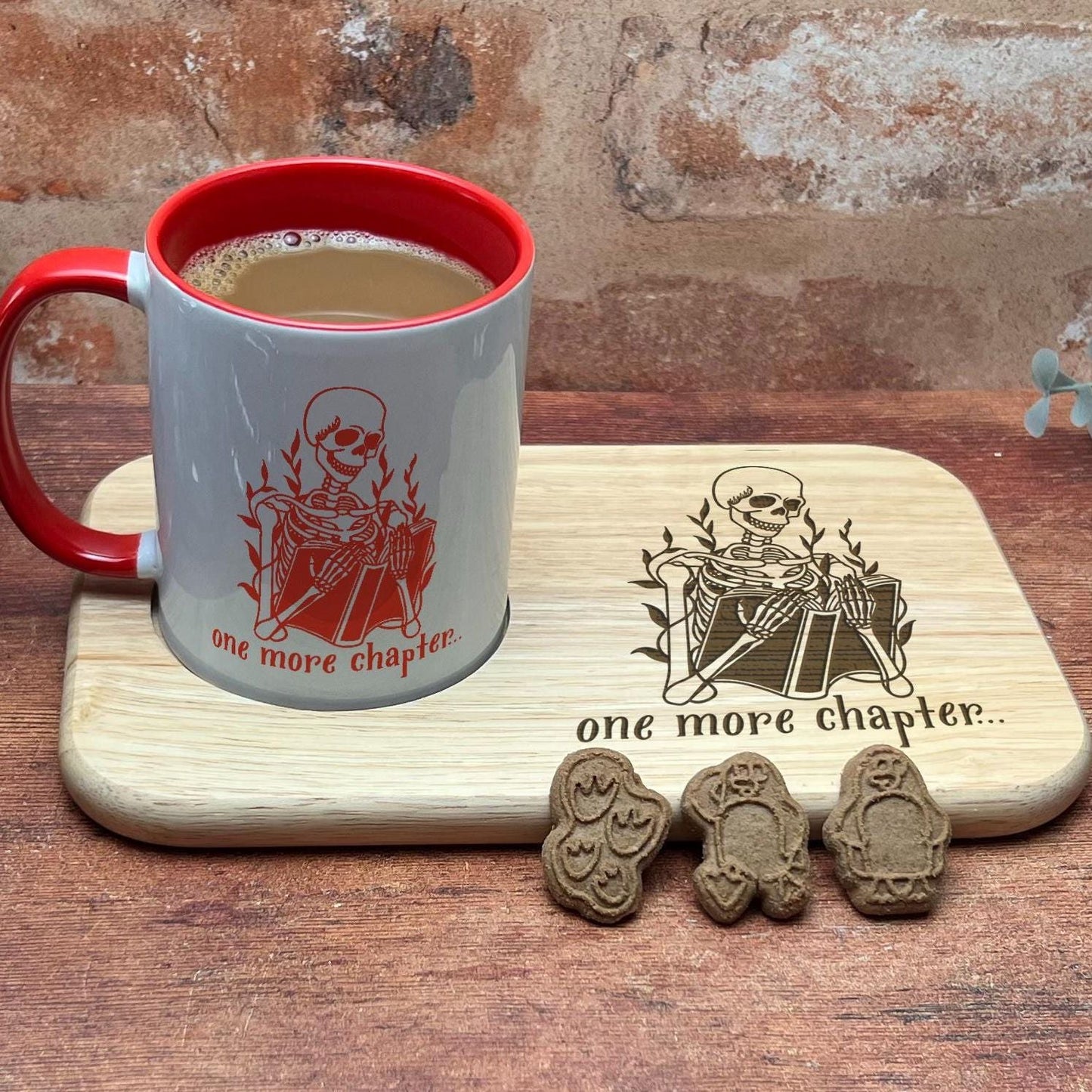 a cup of coffee sitting on top of a wooden table