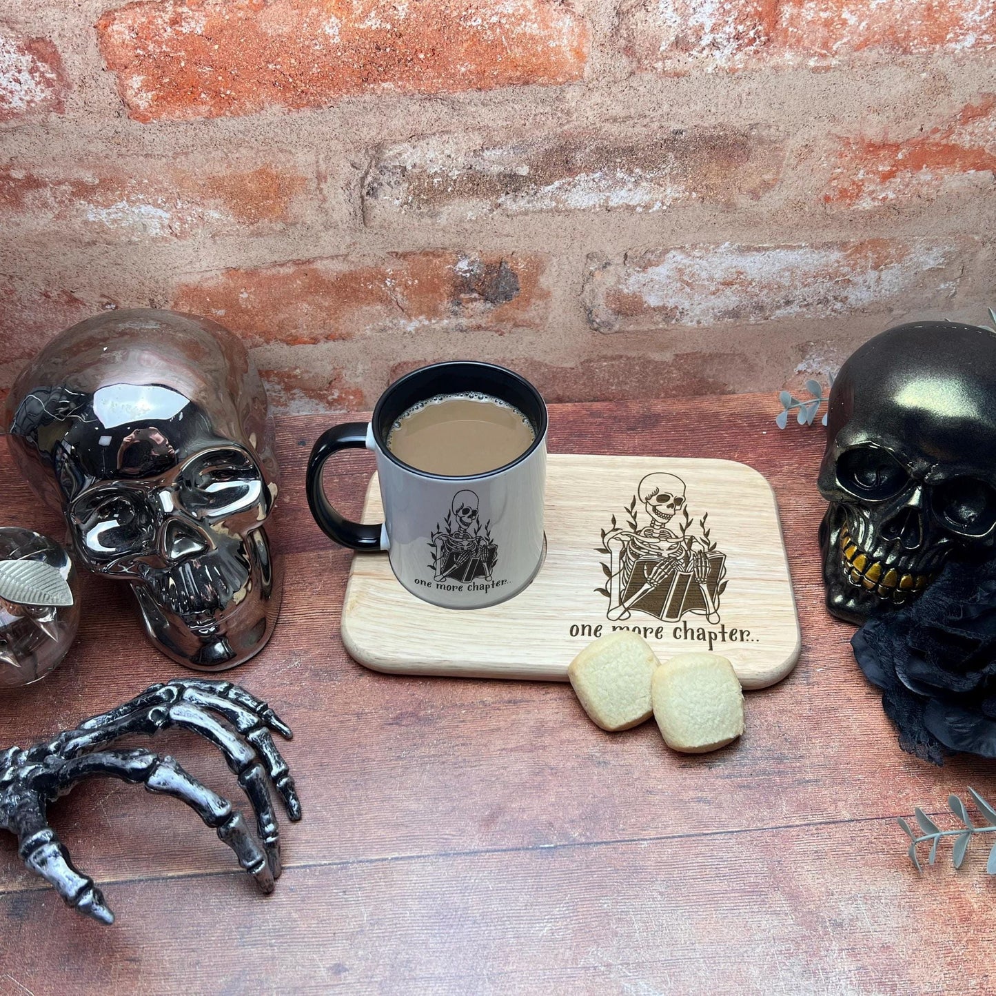a cup of coffee sitting on top of a wooden table