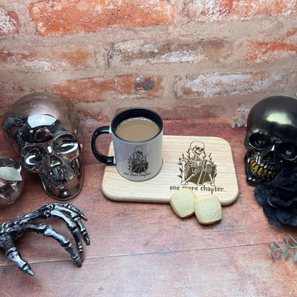a cup of coffee sitting on top of a wooden table