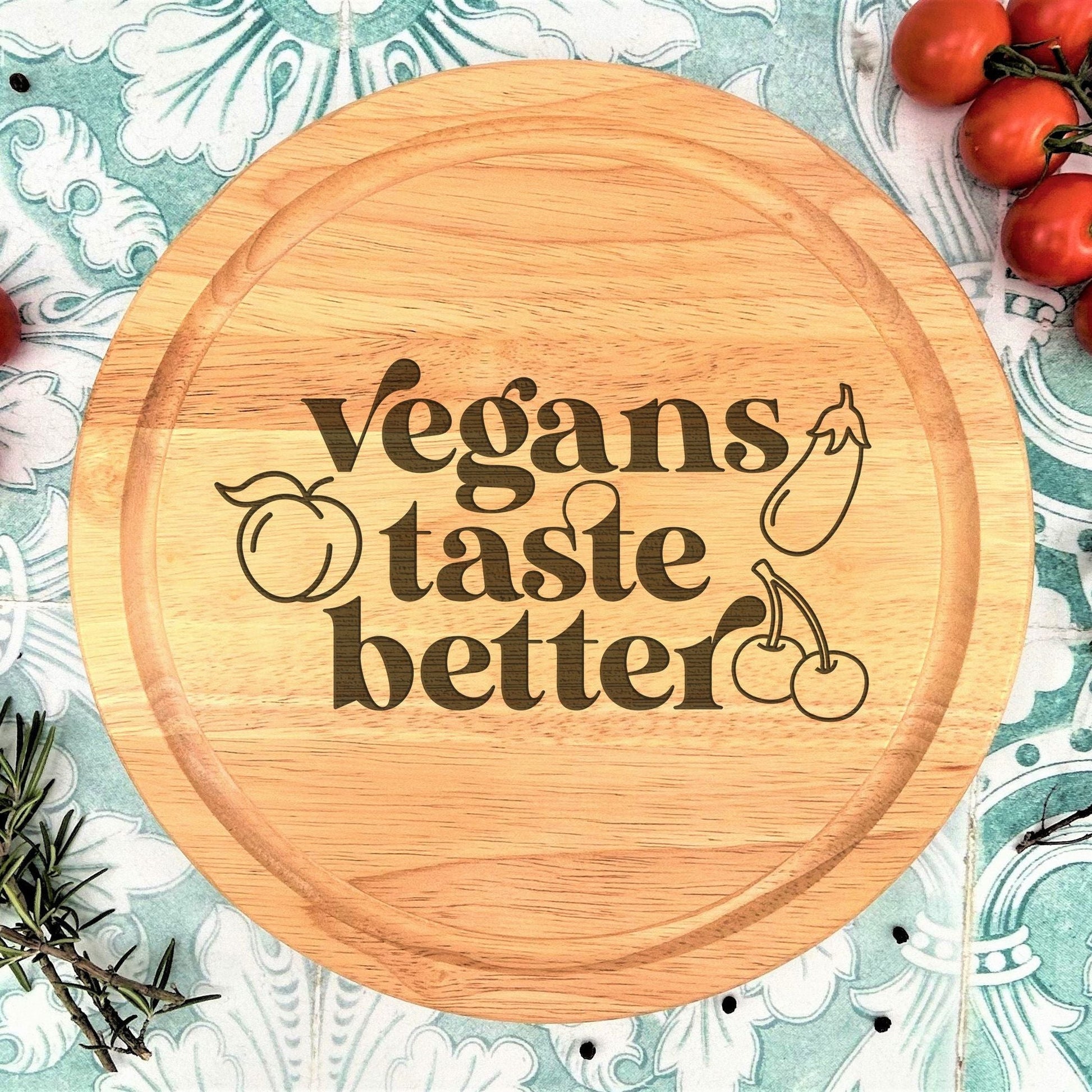 a cutting board with the words vegans taste better on it