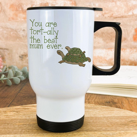 A white travel mug with a black handle, featuring a turtle design and text that reads "You are fort-ally the best mum ever."