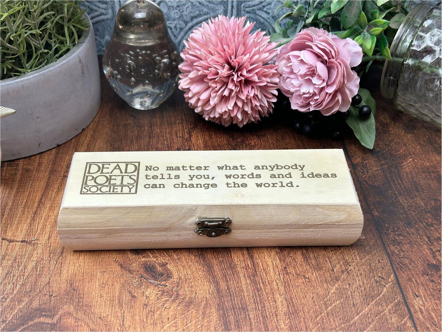 a wooden box sitting on top of a wooden table