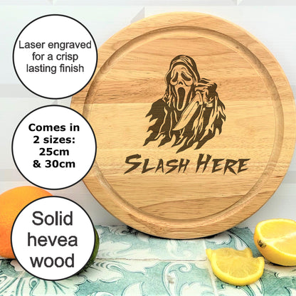 a wooden cutting board with a picture of a ghost on it