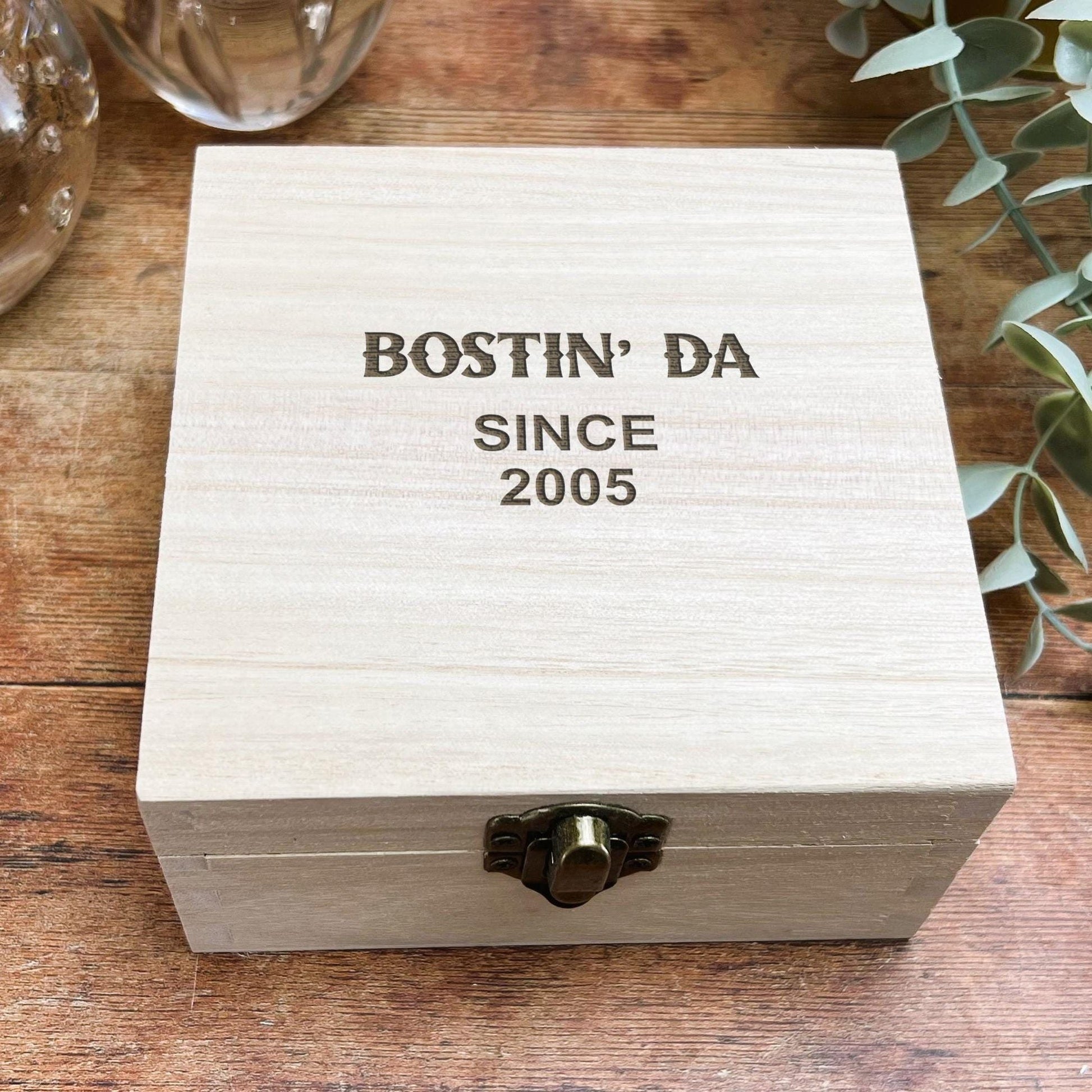 a wooden box sitting on top of a wooden table