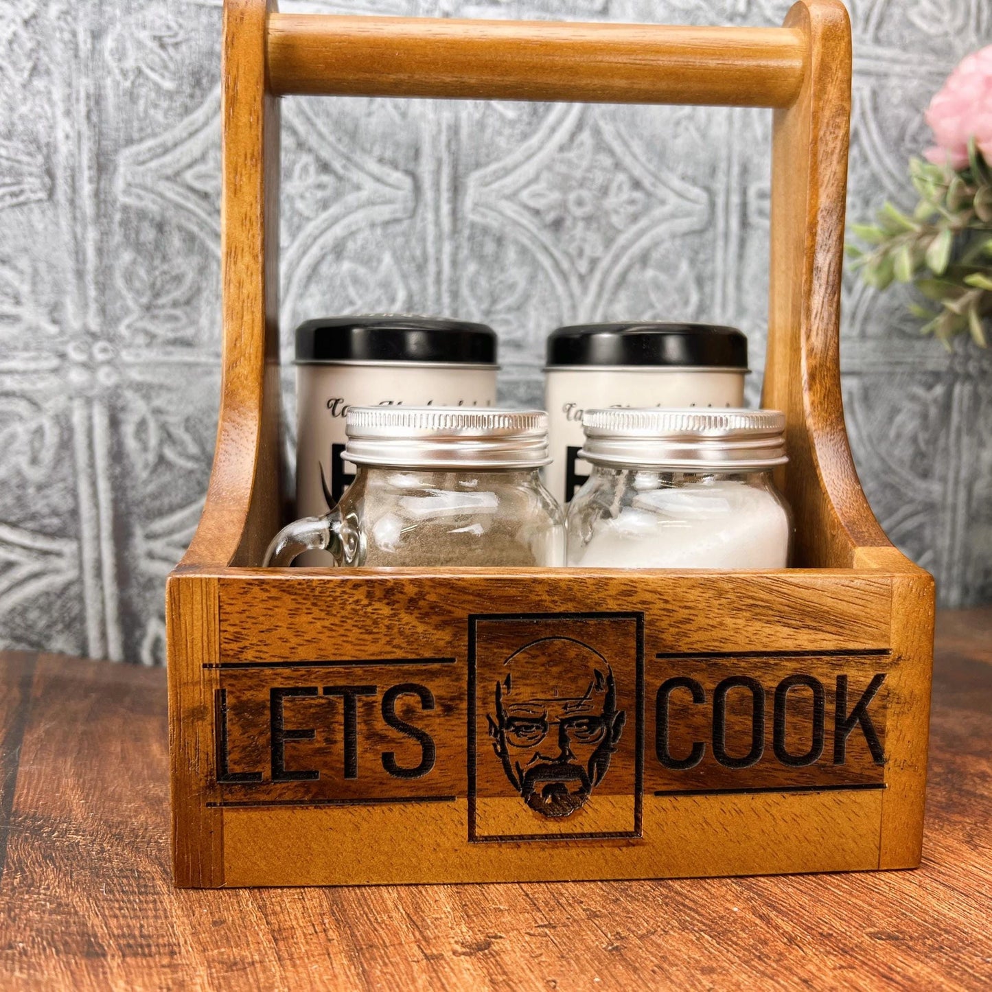 a wooden box filled with jars and a wooden handle