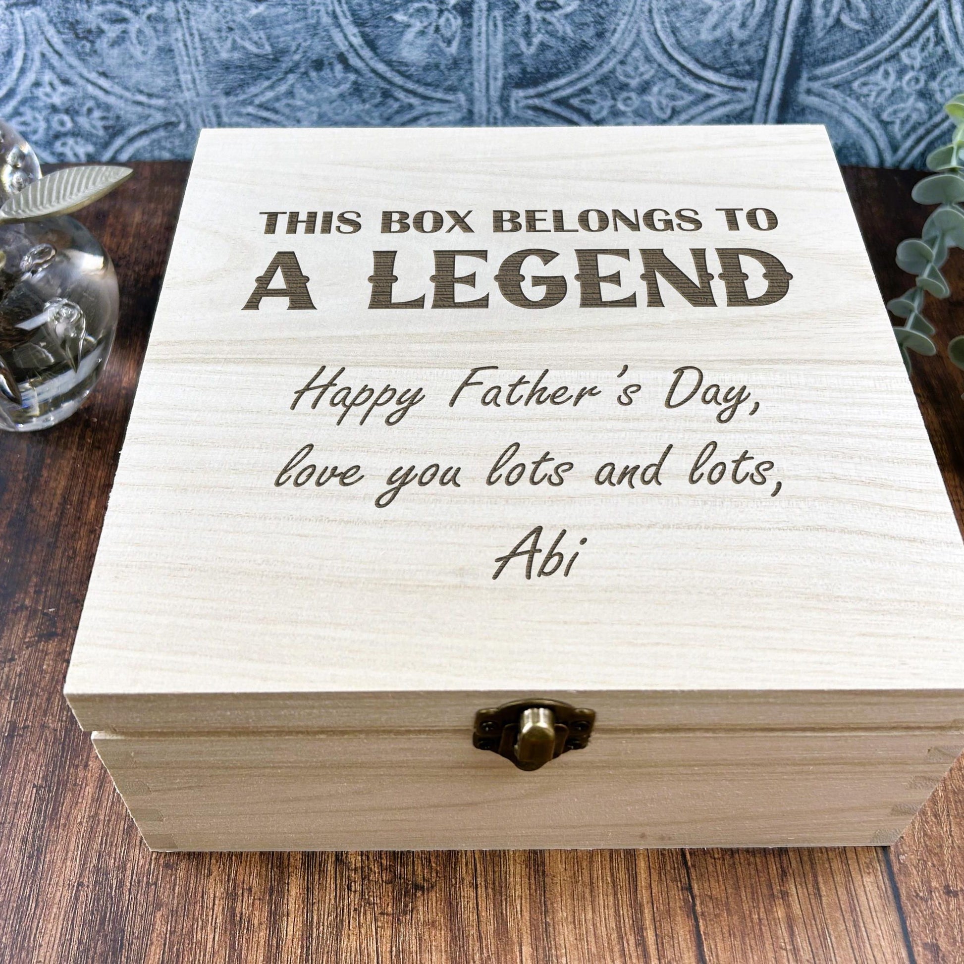 a wooden box sitting on top of a wooden table