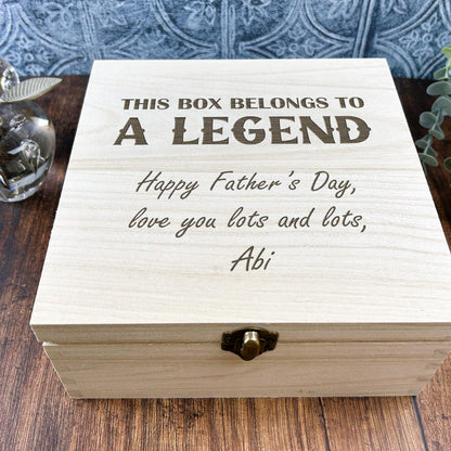 a wooden box sitting on top of a wooden table