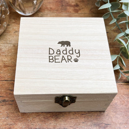 a wooden box sitting on top of a wooden table