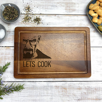 a wooden cutting board with a picture of a man on it