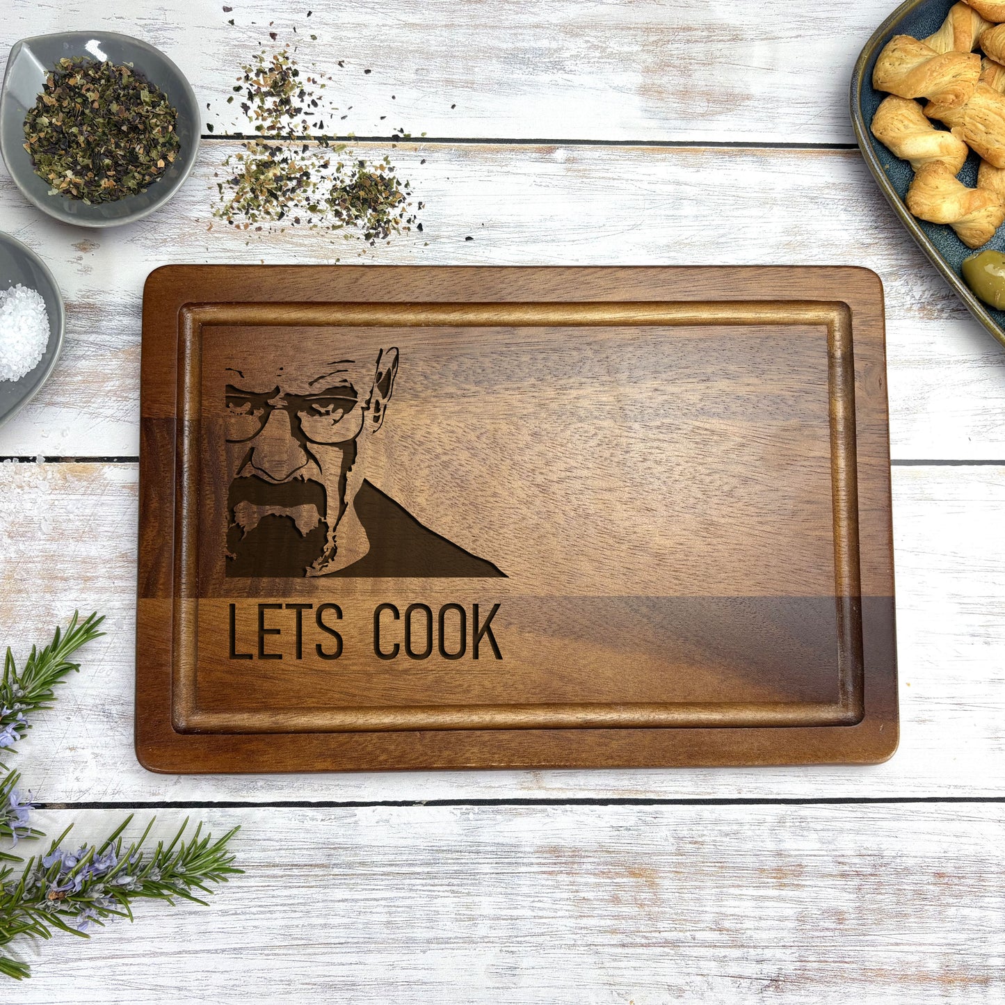 a wooden cutting board with a picture of a man on it