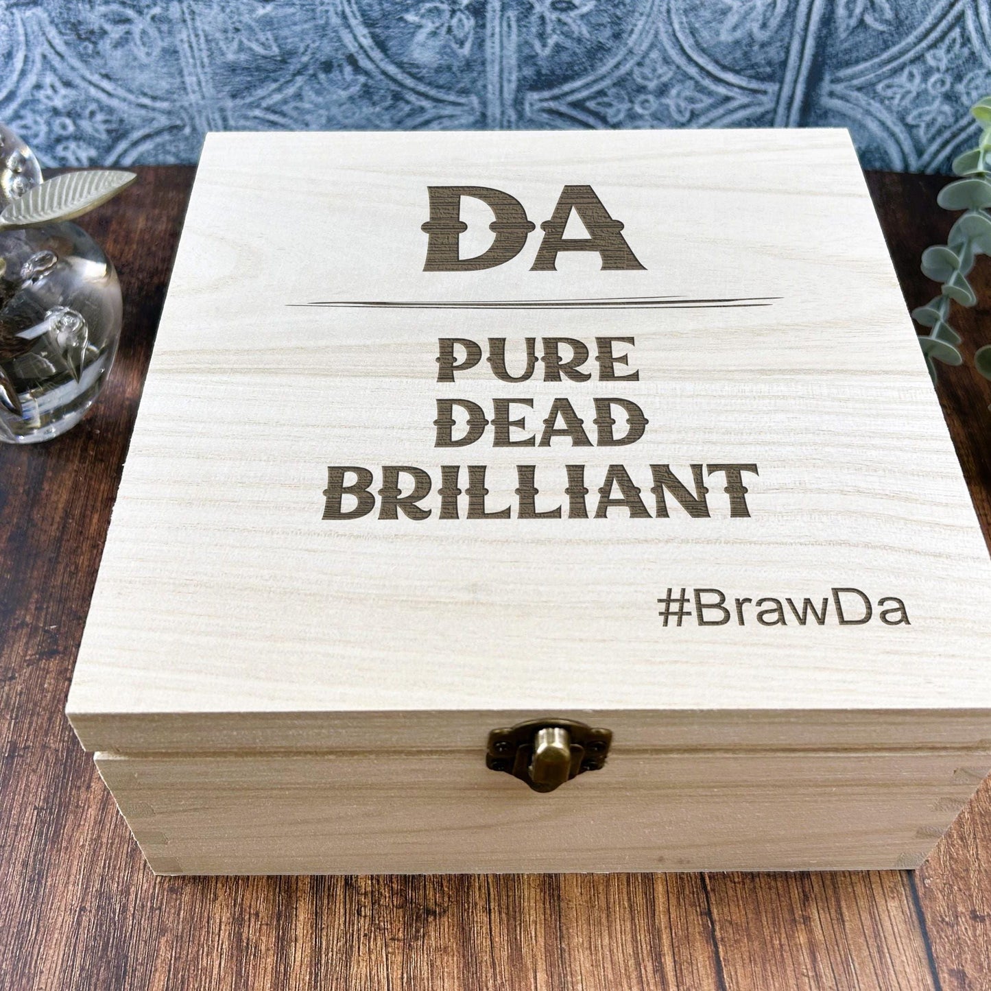 a wooden box sitting on top of a wooden table