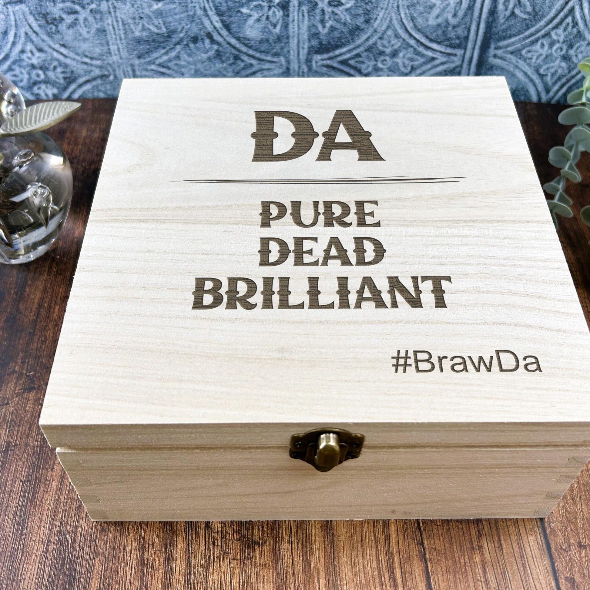 a wooden box sitting on top of a wooden table