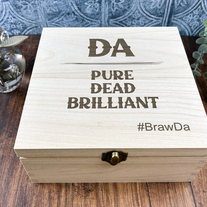 a wooden box sitting on top of a wooden table