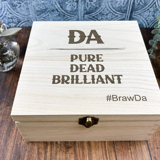 a wooden box sitting on top of a wooden table