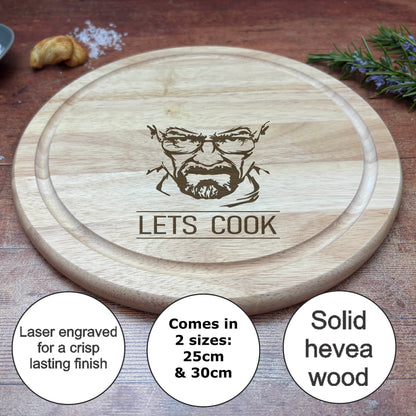 a wooden cutting board with the words let's cook on it