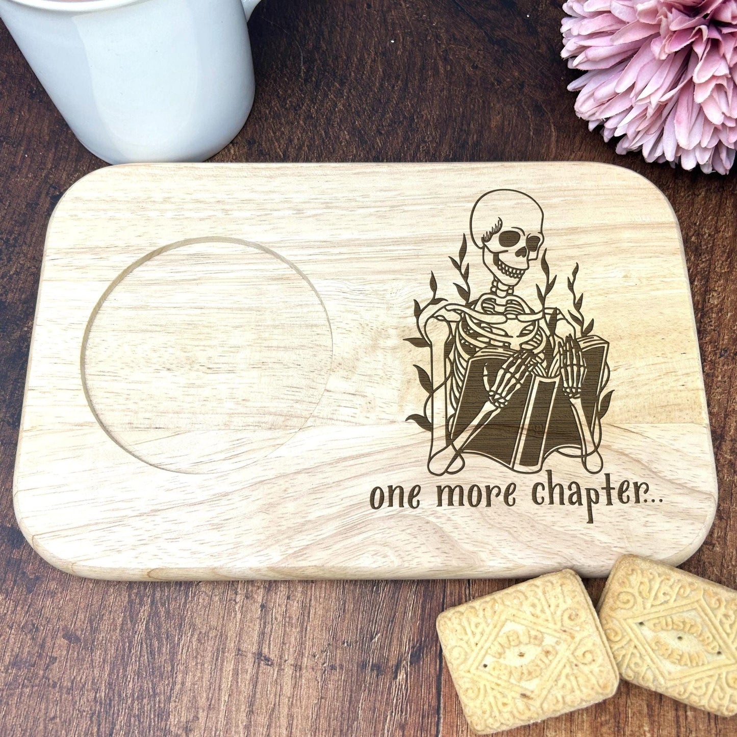 a wooden coaster with a picture of a skeleton on it