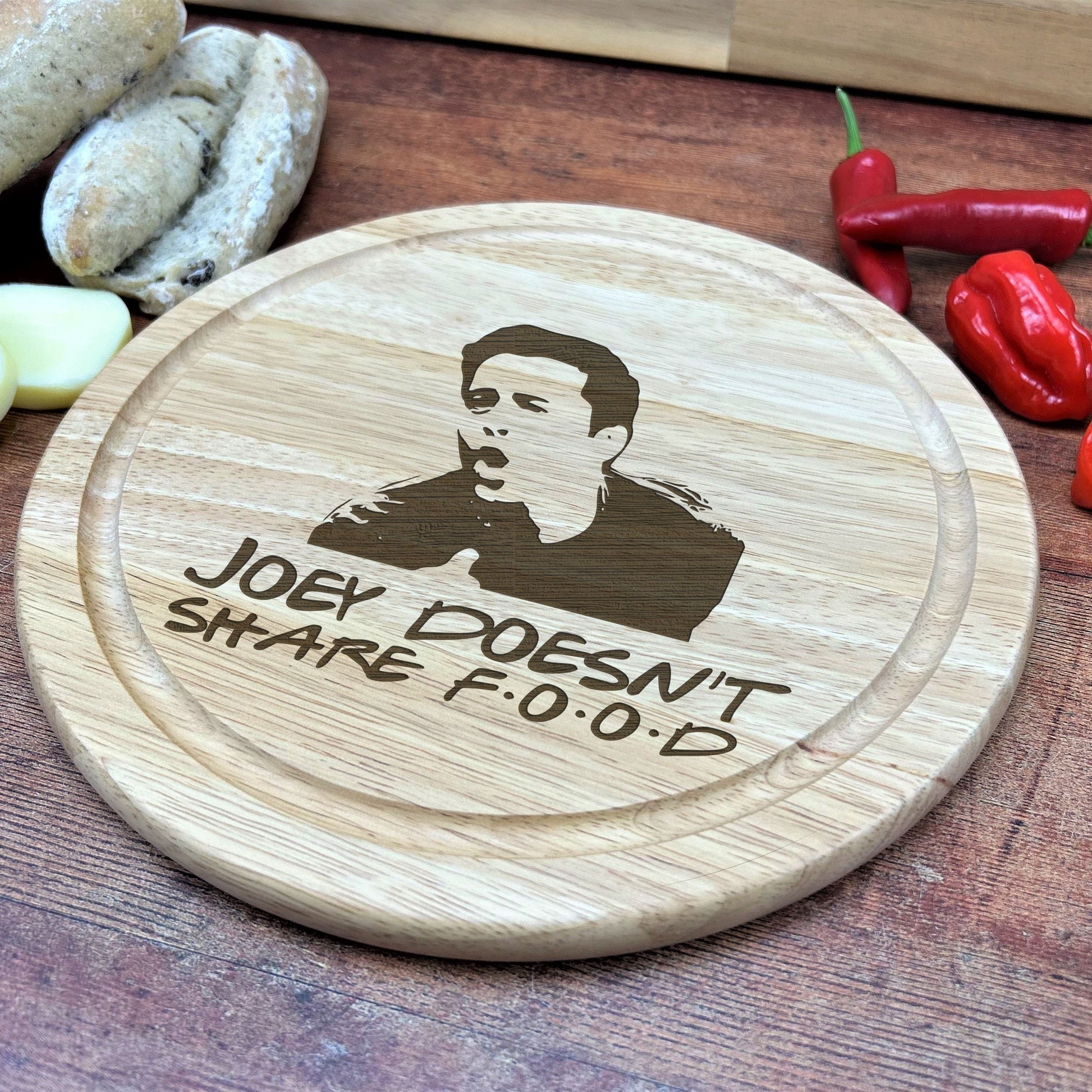 a wooden cutting board with a picture of a man on it