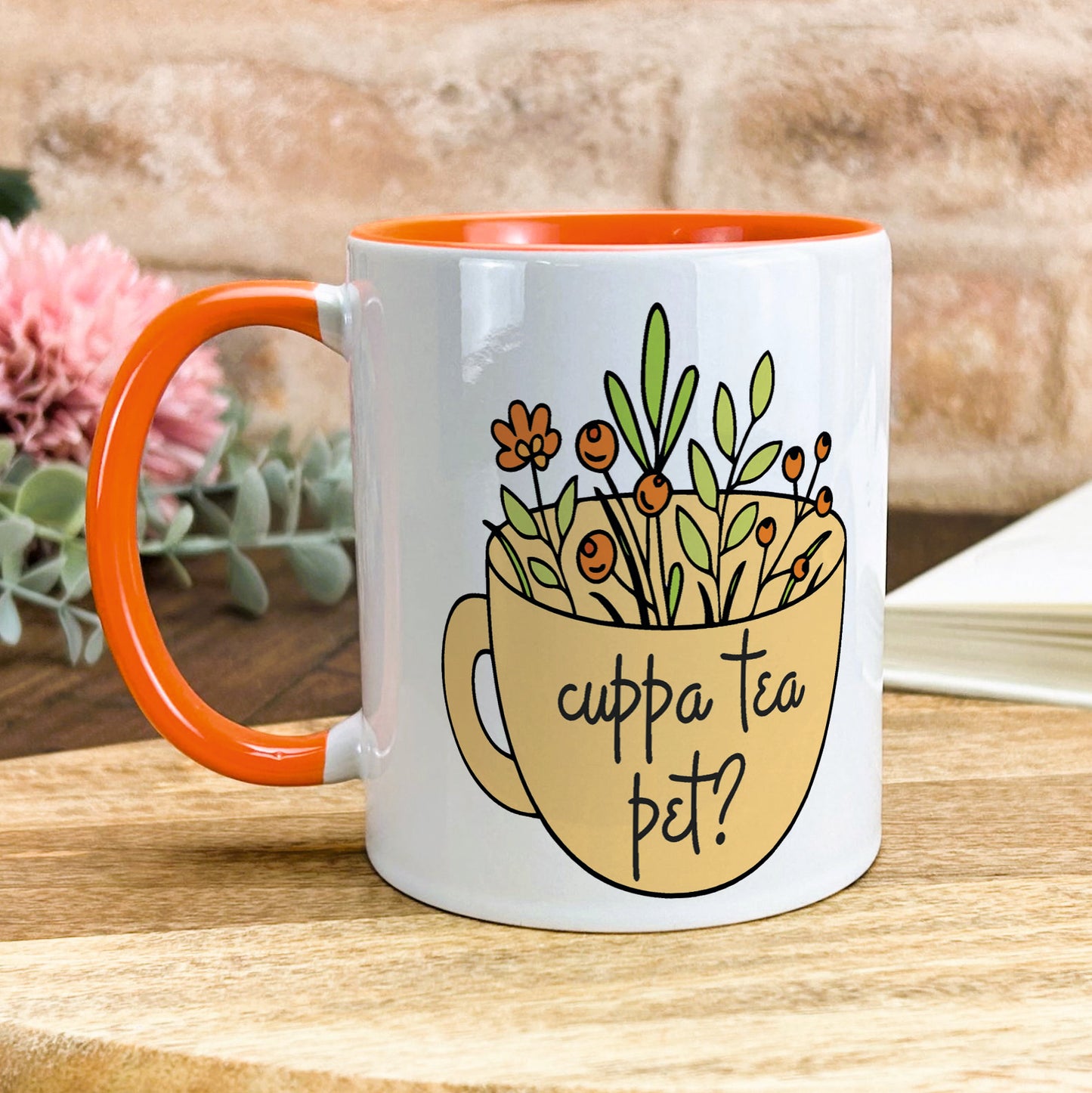 a coffee mug with a picture of flowers in it