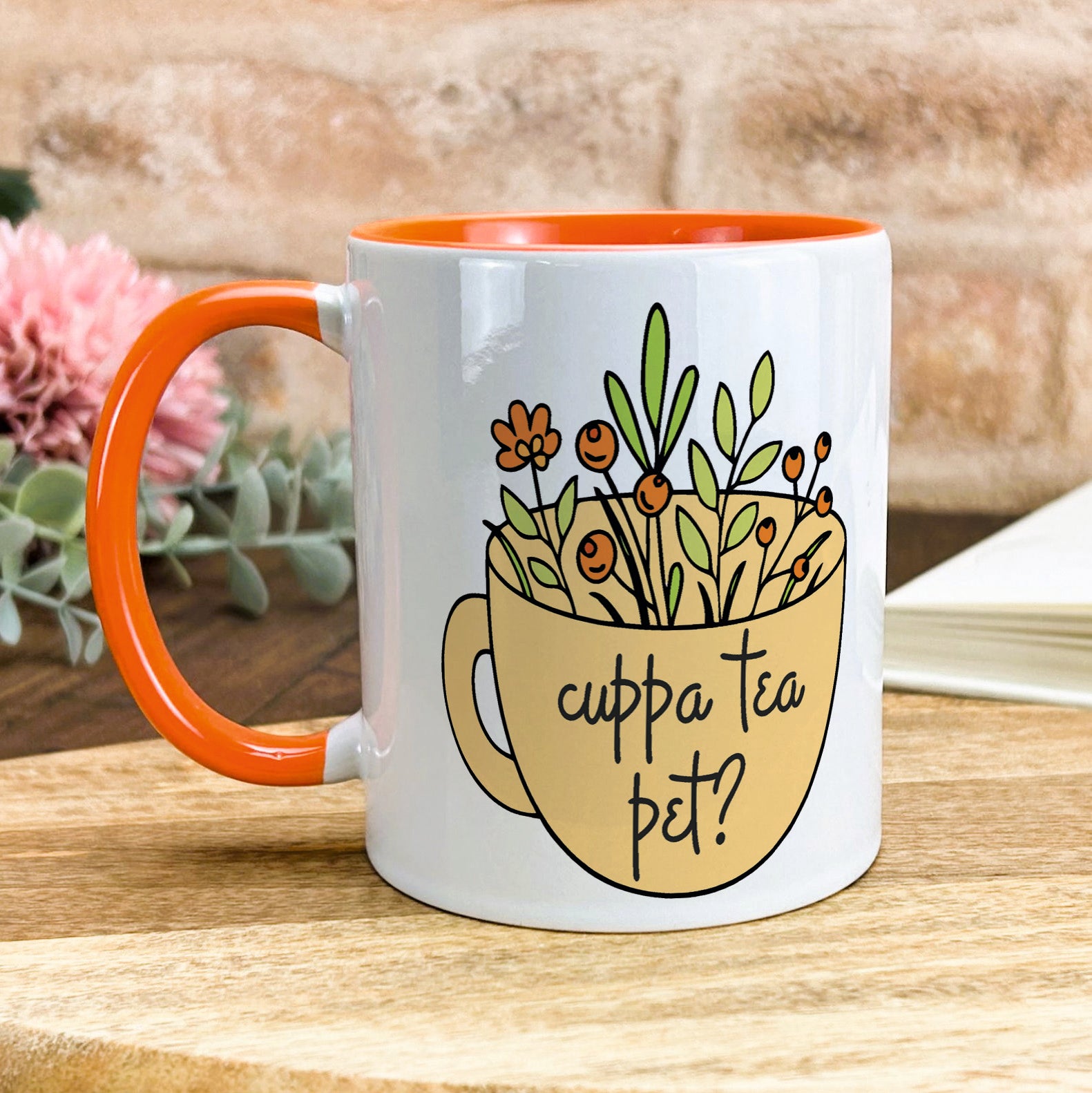 a coffee mug with a picture of flowers in it