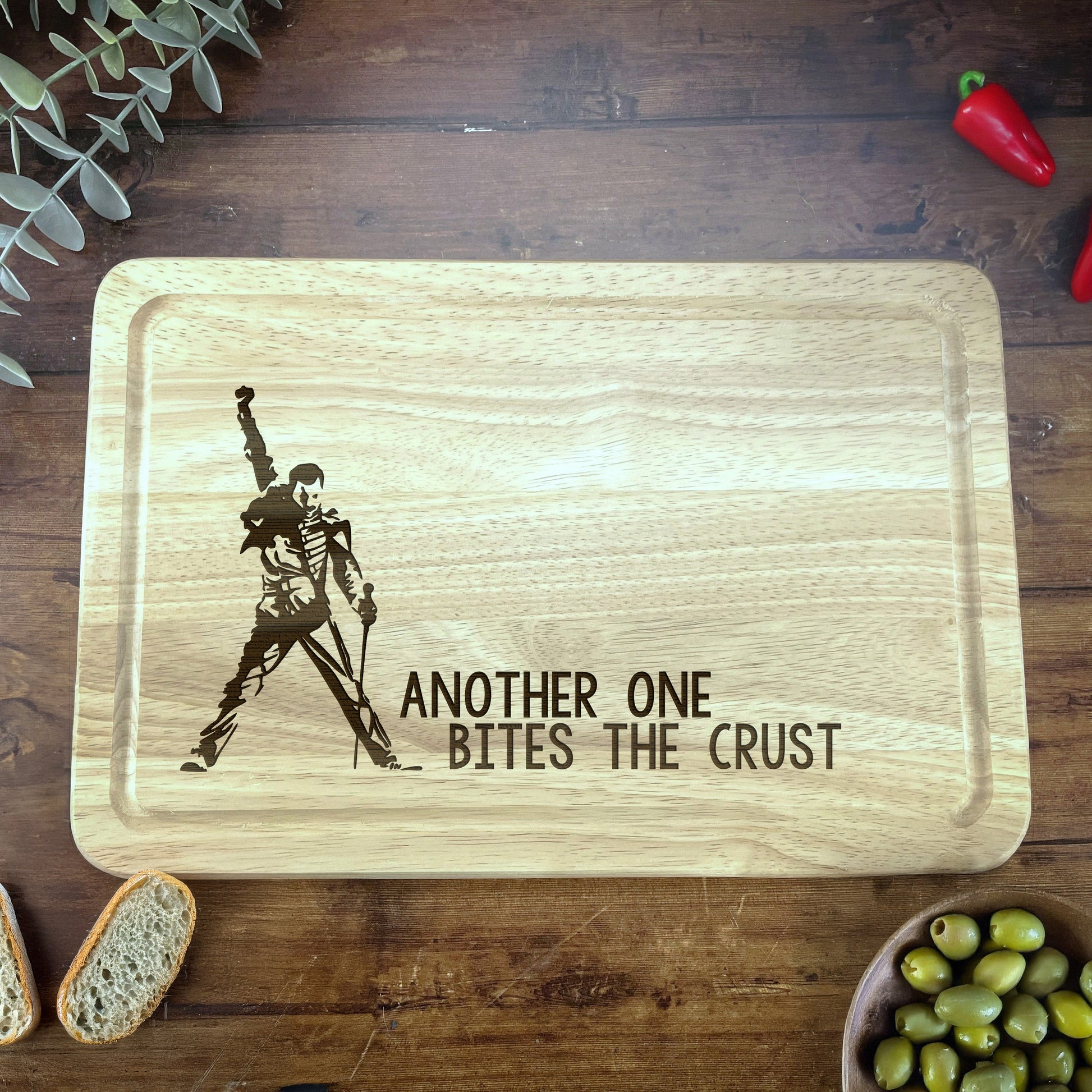 a wooden cutting board with a picture of a man holding a sword