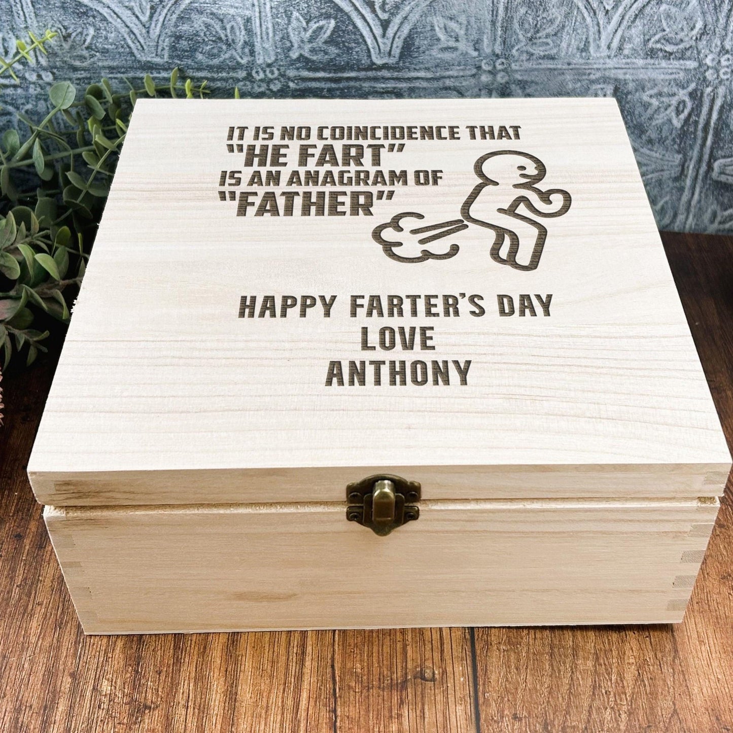a wooden box sitting on top of a wooden table