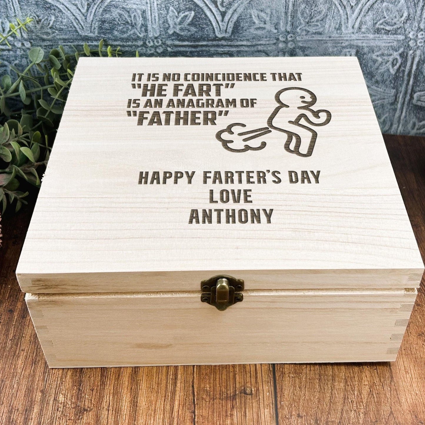 a wooden box sitting on top of a wooden table