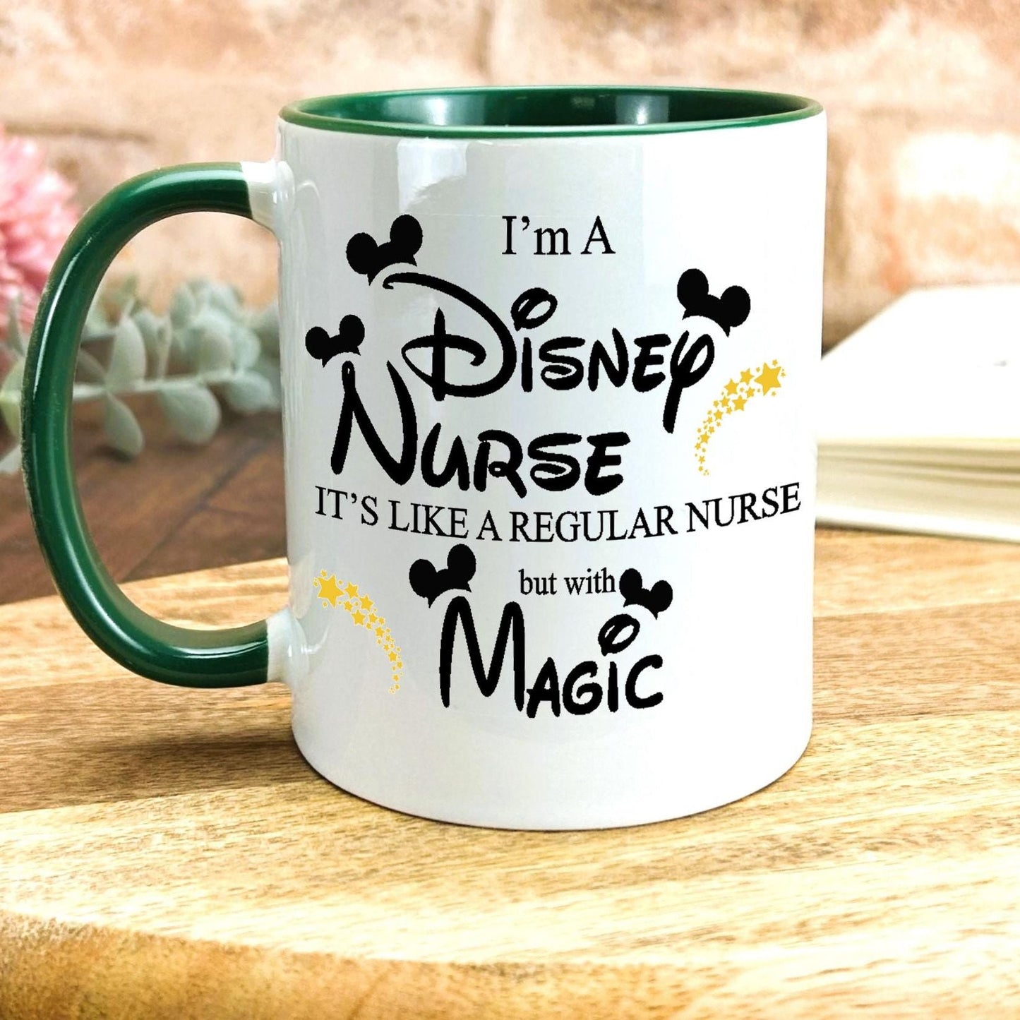 a green and white coffee mug sitting on top of a wooden table