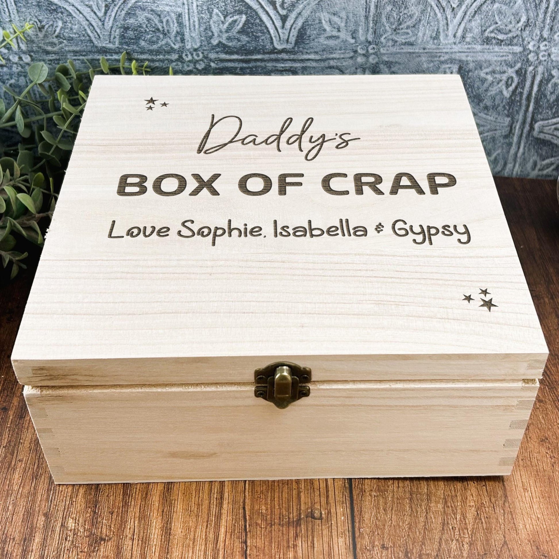 a wooden box with the words daddy's box of crap on it